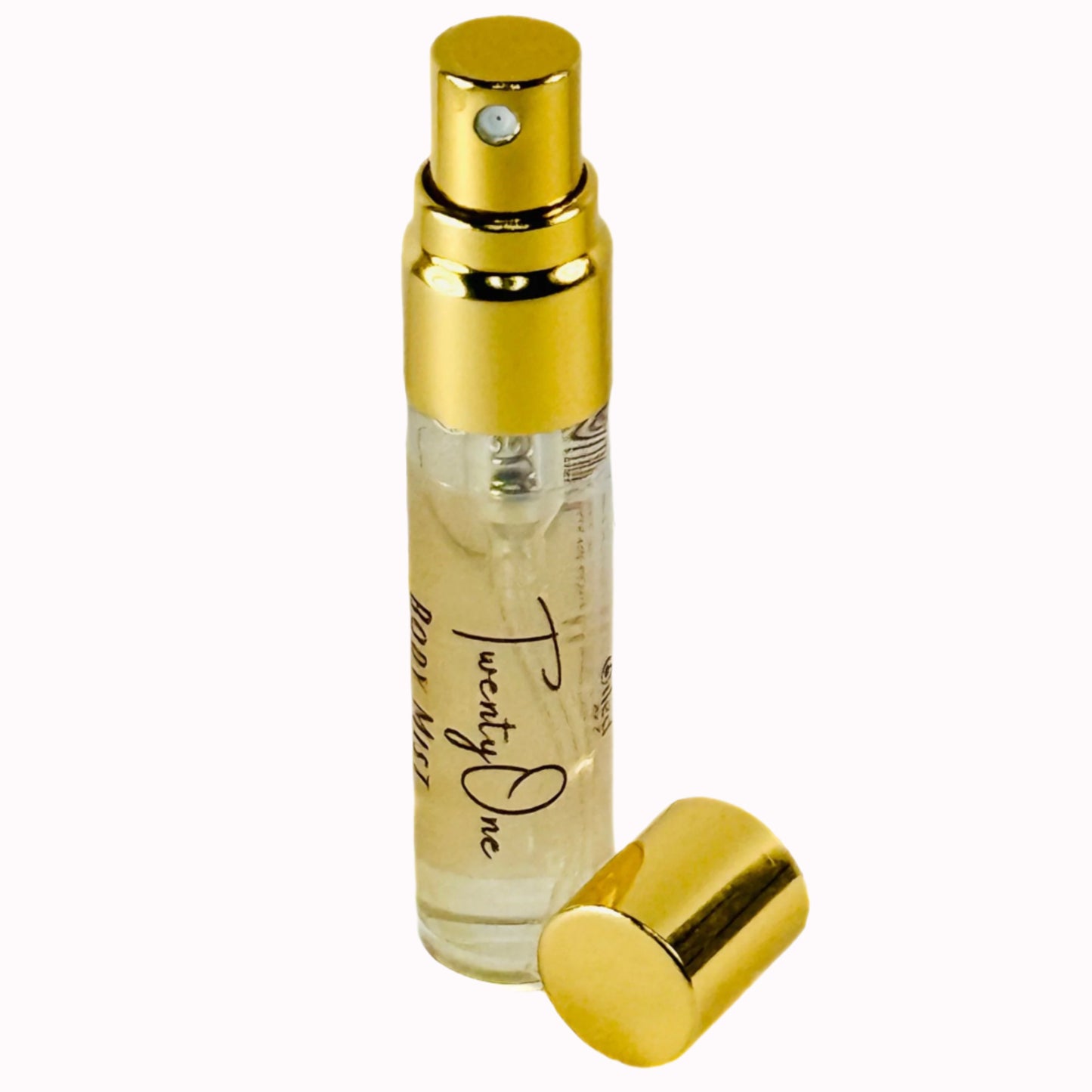 Small perfume bottle with gold cap and clear body on a white background