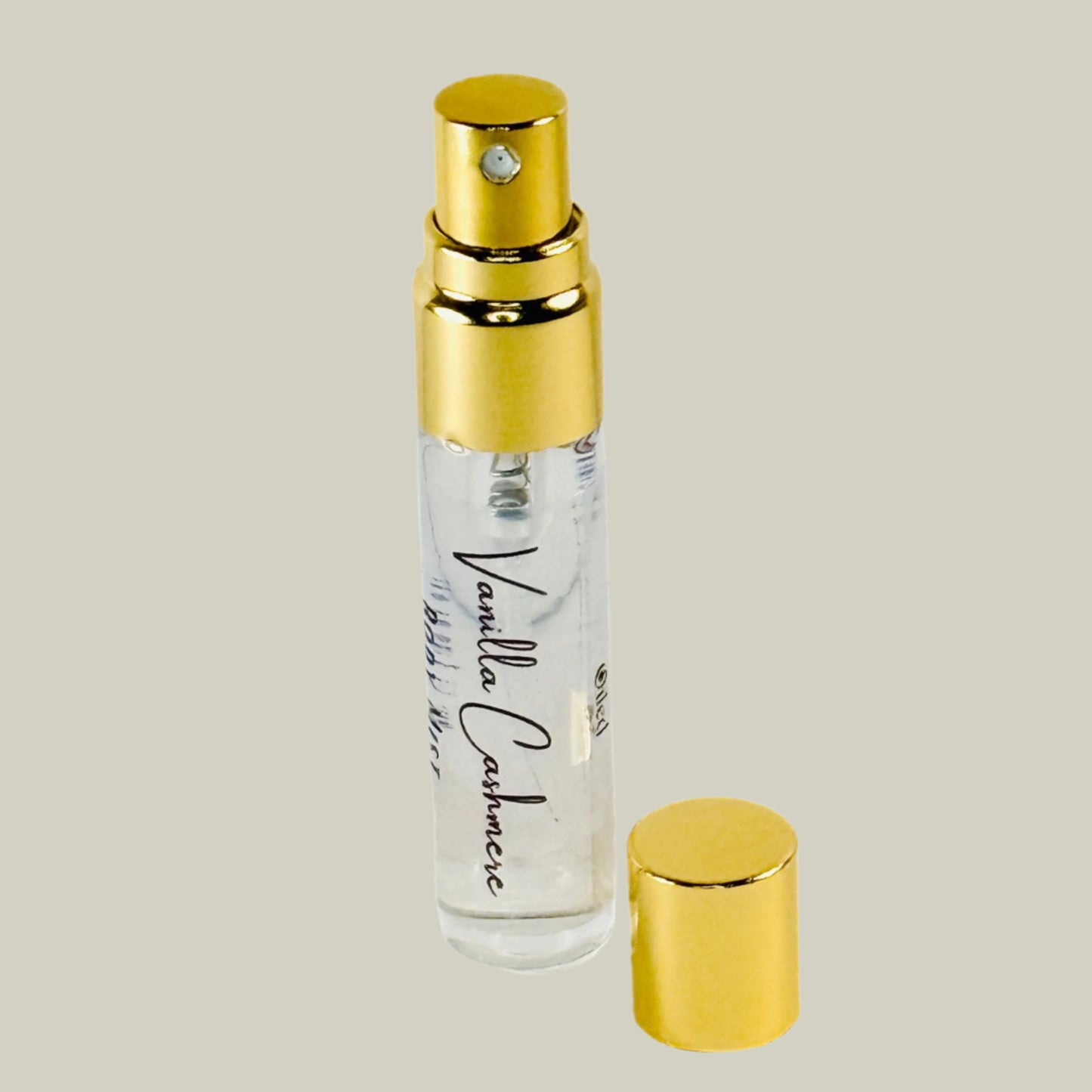 Vanilla Cashmere perfume bottle with gold cap and base on a white background