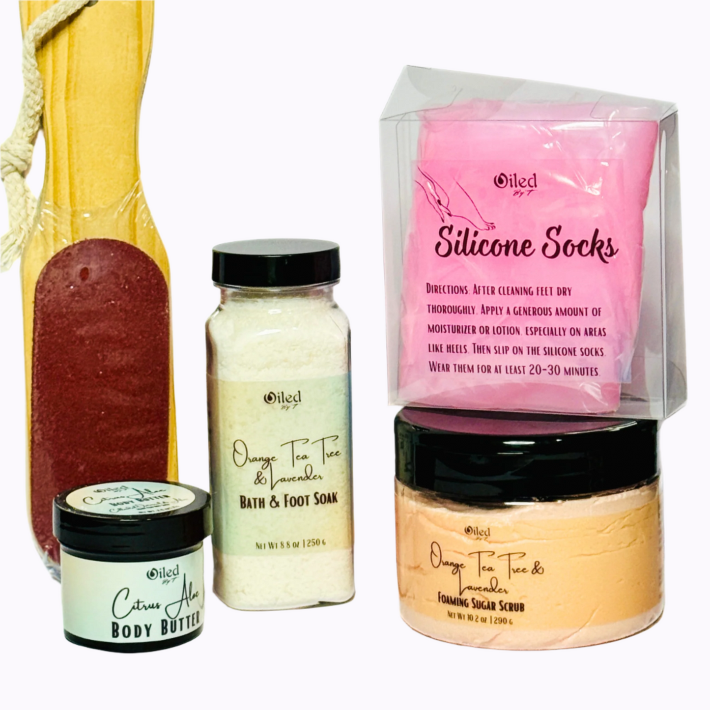 Collection of beauty and skincare products including soap, body butter, and scrub.