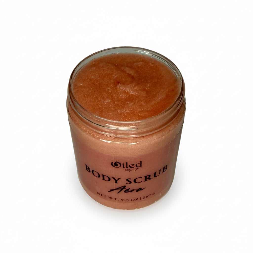 Jar of body scrub with a white background opened to see inside contents of jar