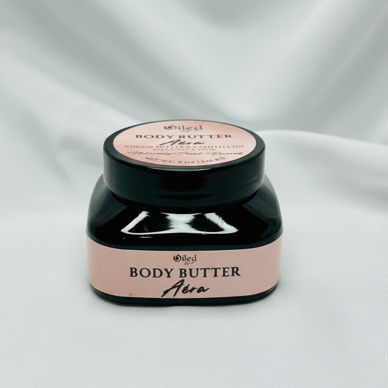 Body butter container with pink lid and label on a white background