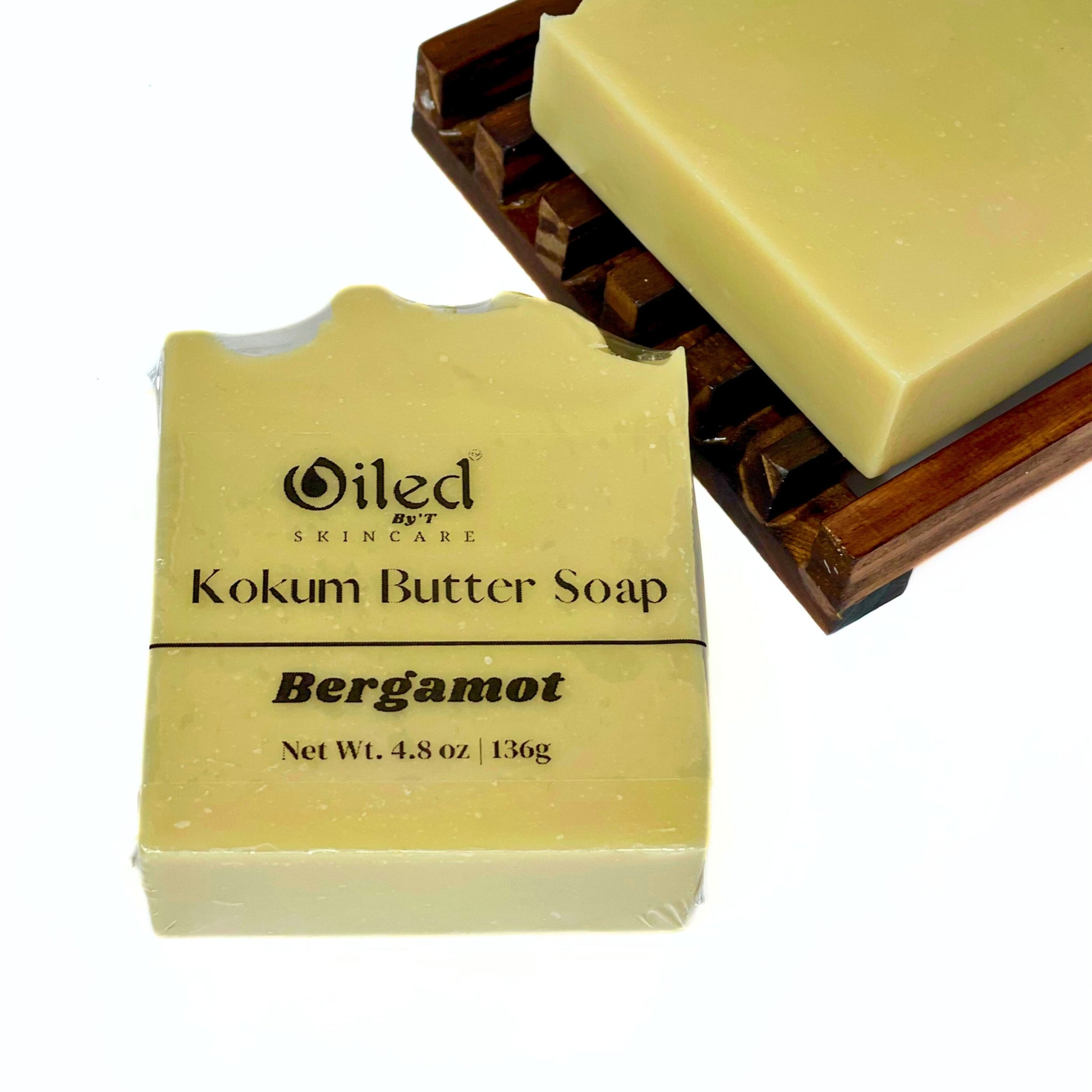 Bergamot scented soap displayed on wooden soap dish 