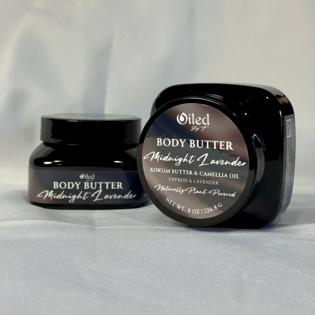 Two jars of Oiled By T Body Butter, Midnight Lavender, on a light gray background