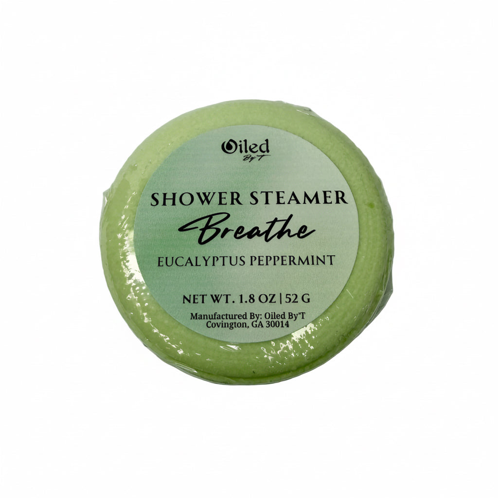 Green shower steamer labeled 'Breathe' with a white label on a white background