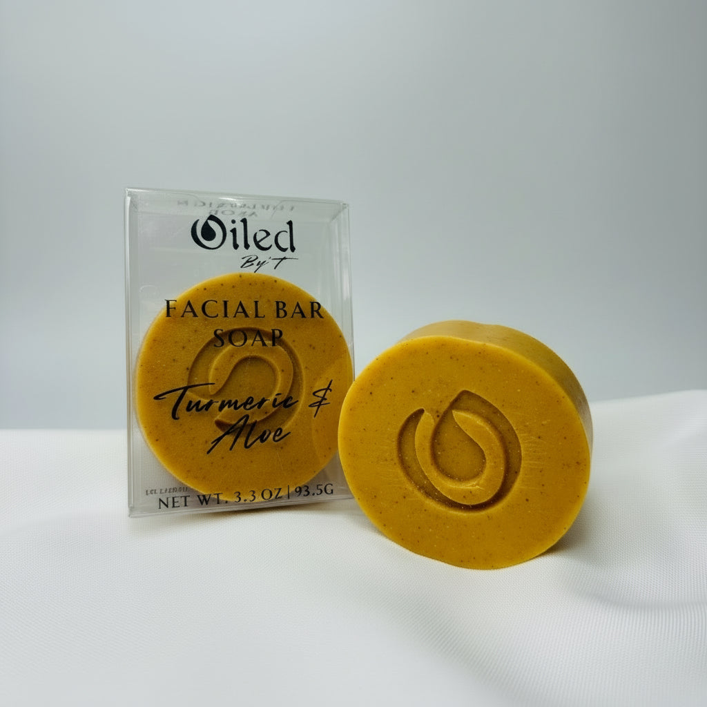 Orange facial bar soap with packaging labeled 'Oiled by T' on a white background