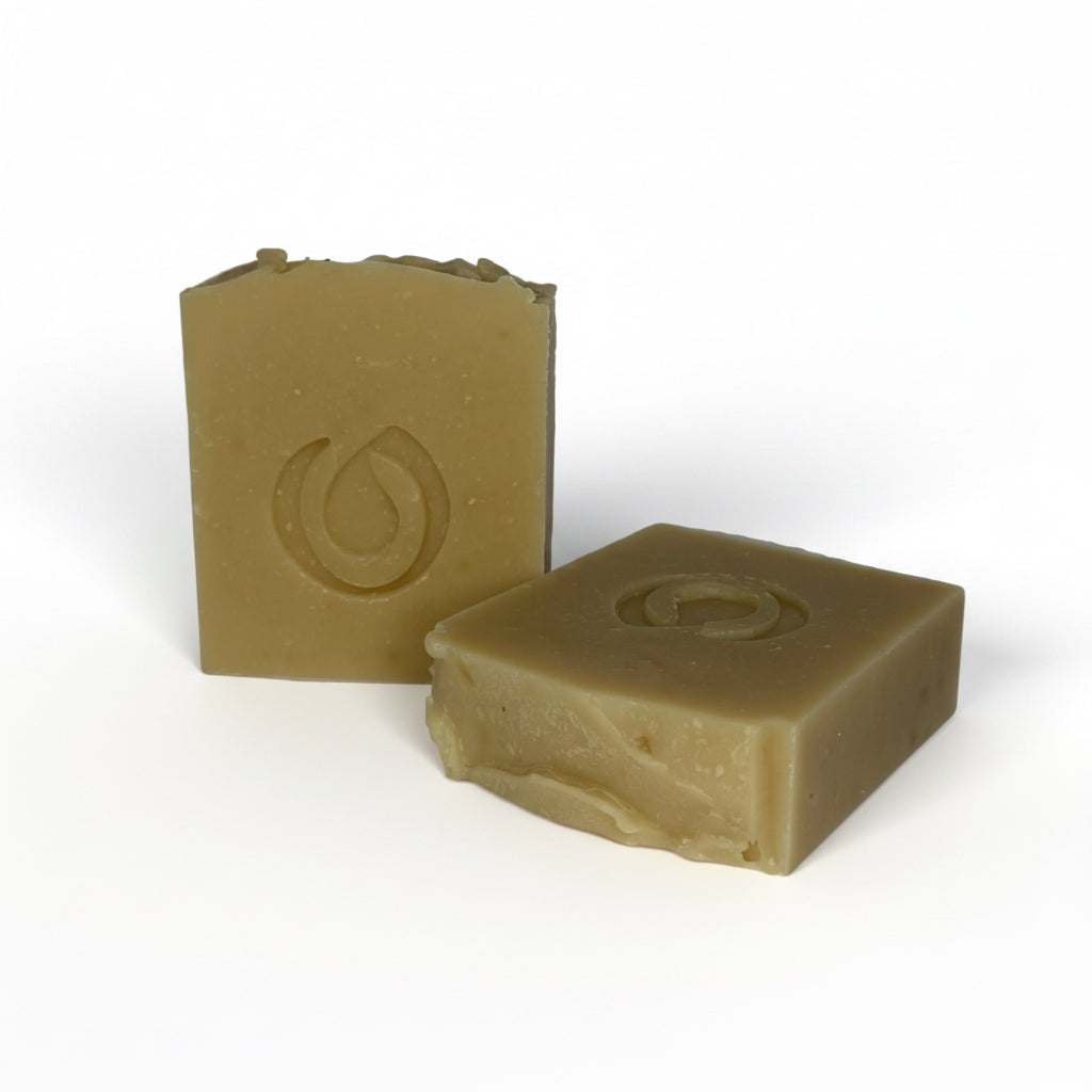 Two square bars of soap with a logo on a white background