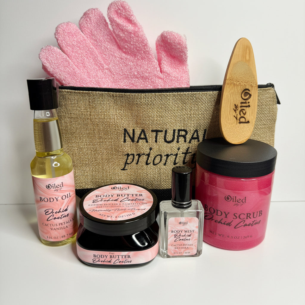 Collection of Oiled Body Care products including gloves, oil, scrub, and lotion on a white background.