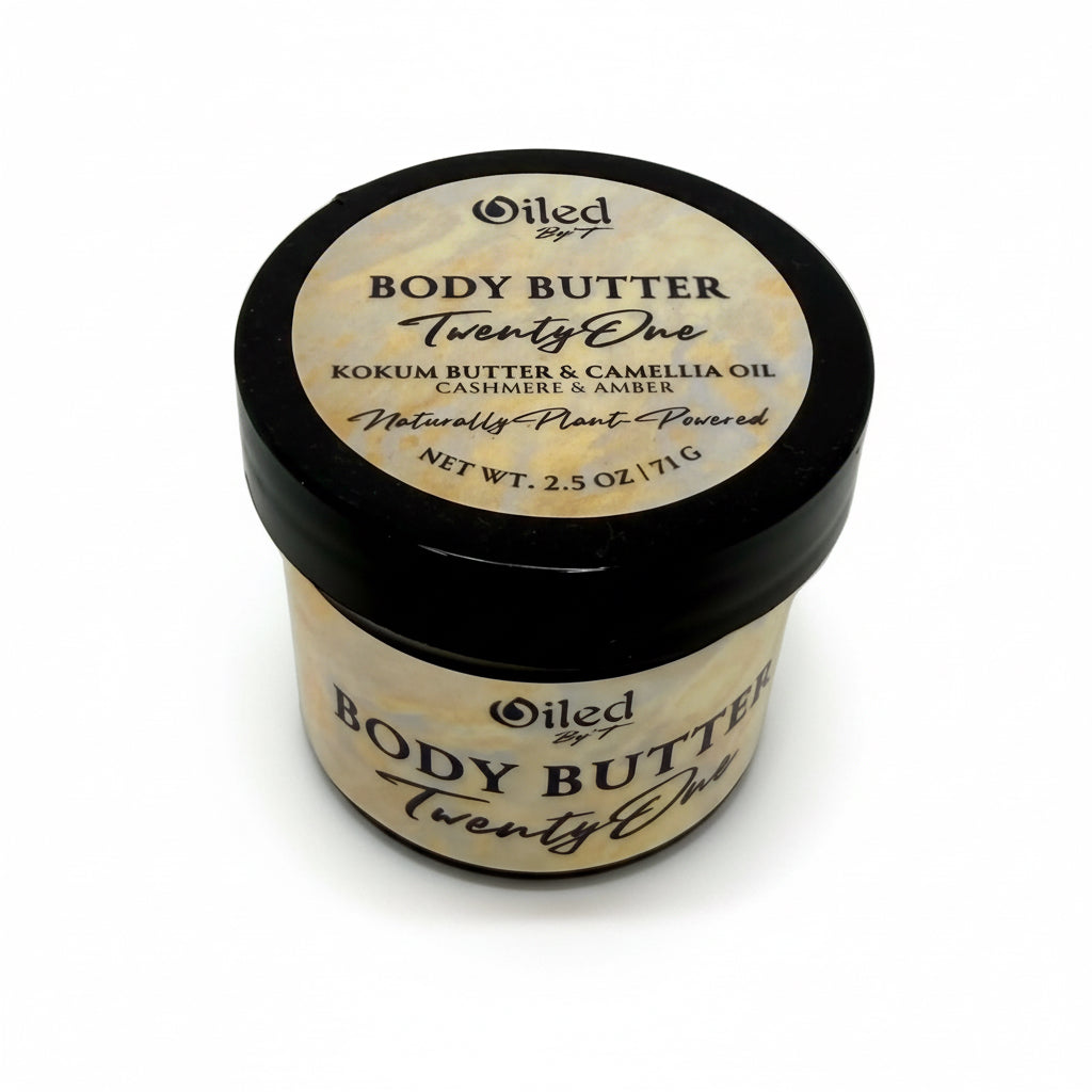 2oz Jar of body butter with a black lid on a white background