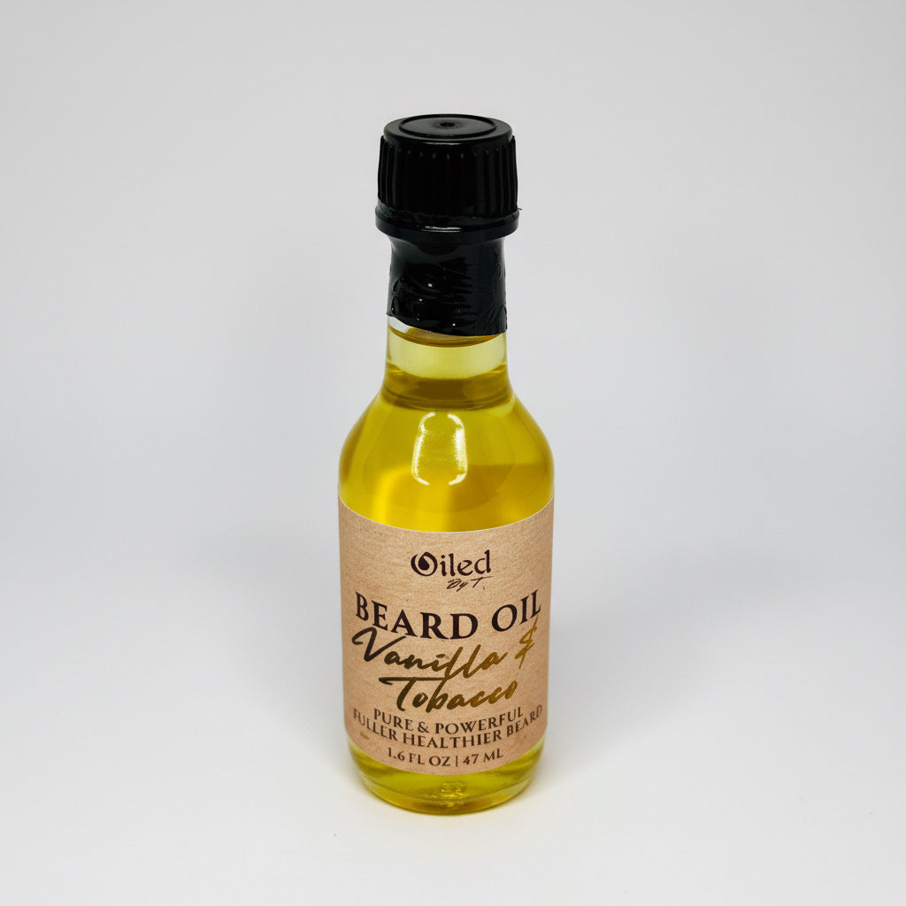 Bottle of vanilla and tobacco beard oil with a black cap on a white background