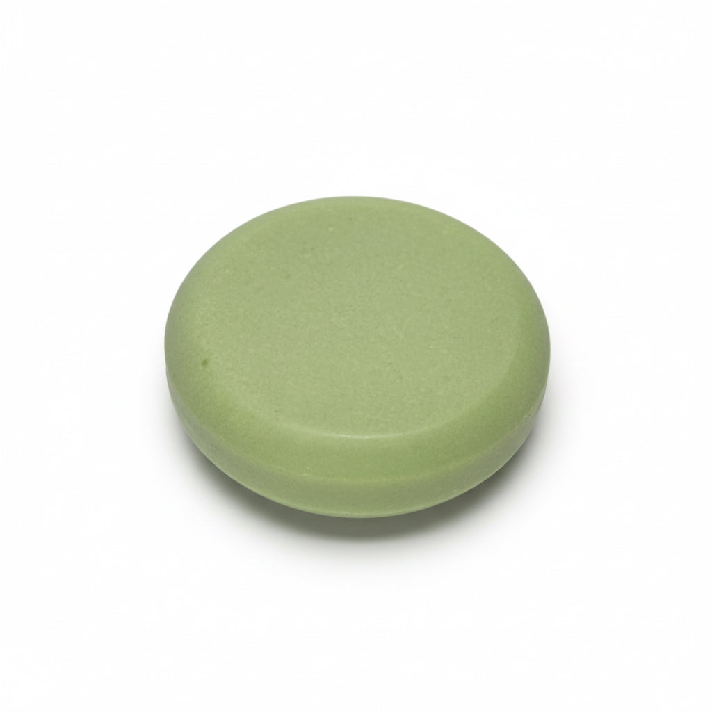 Green circular shower steamer  on a white background